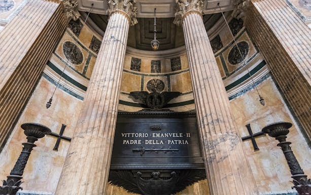 Tomb of King Victor Emmanuel II inside the Pantheon, Rome, with marble columns.