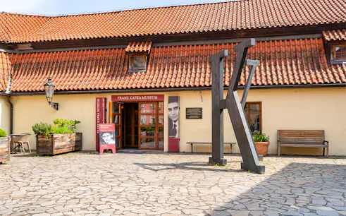Franz Kafka Museum entrance with large K sculpture, Prague.