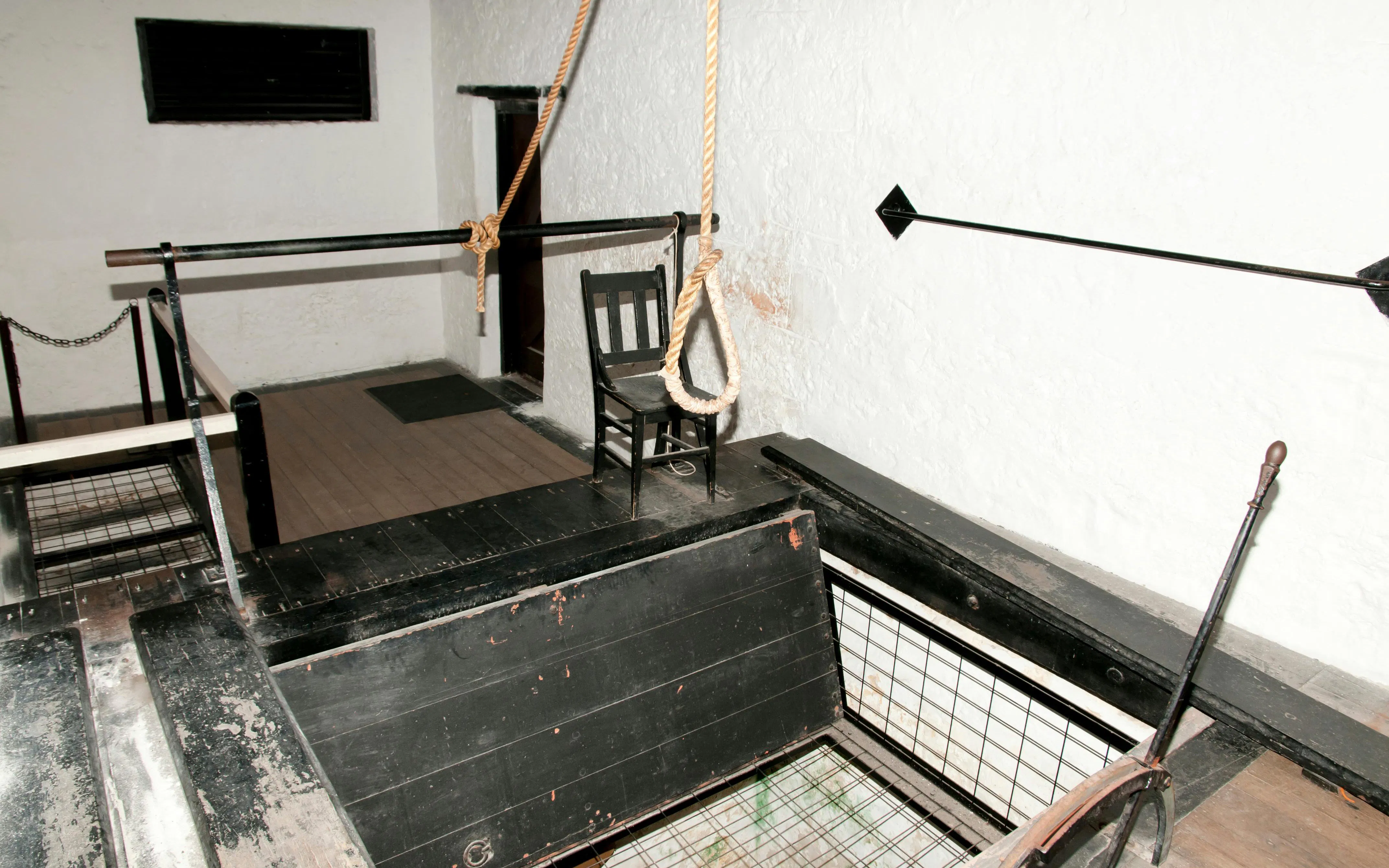 Hangman gallows with noose and chair inside Fremantle Prison.