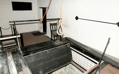 Hangman gallows with noose and chair inside Fremantle Prison.