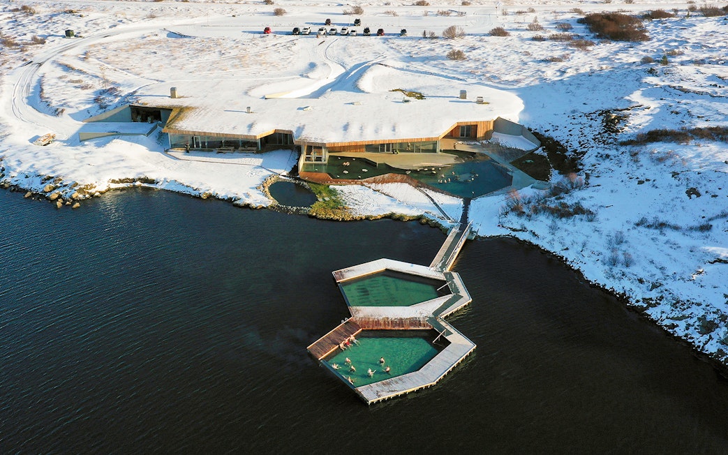 Vök Baths geothermal pools in snowy landscape, Egilsstaðir, Iceland.