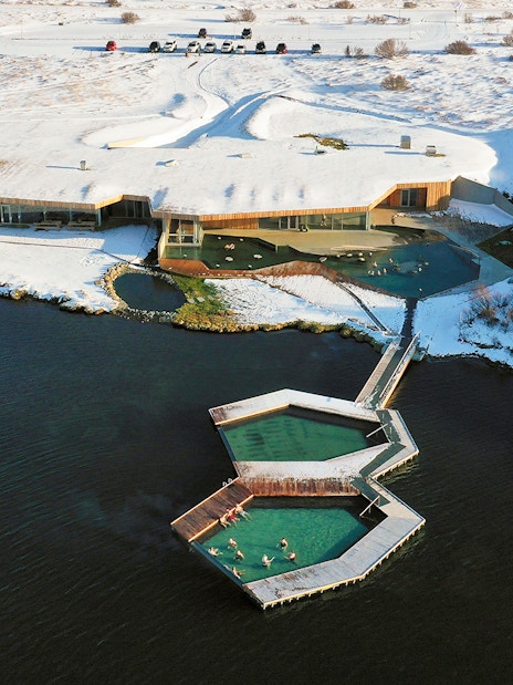 Vök Baths geothermal pools in snowy landscape, Egilsstaðir, Iceland.