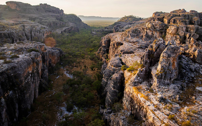 Kakadu National Park rocky escarpment and lush valley view during guided day tour.
