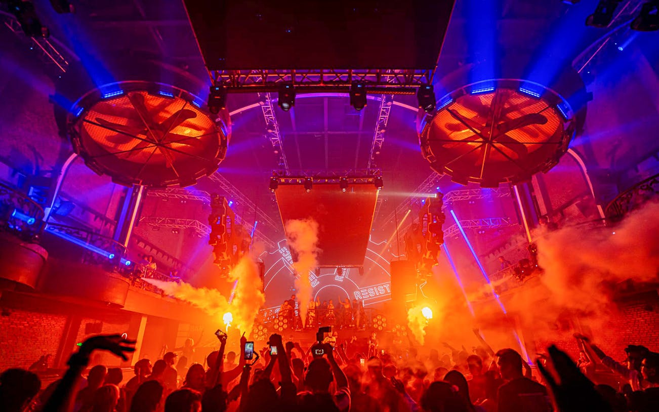 Atlas Beach Club Bali New Year Eve 2025 concert with vibrant lights and crowd.