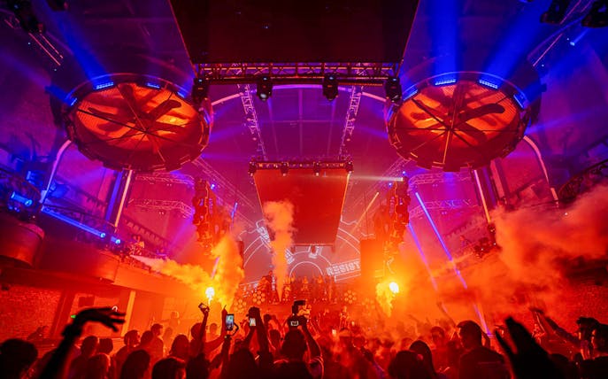 Atlas Beach Club Bali New Year Eve 2025 concert with vibrant lights and crowd.