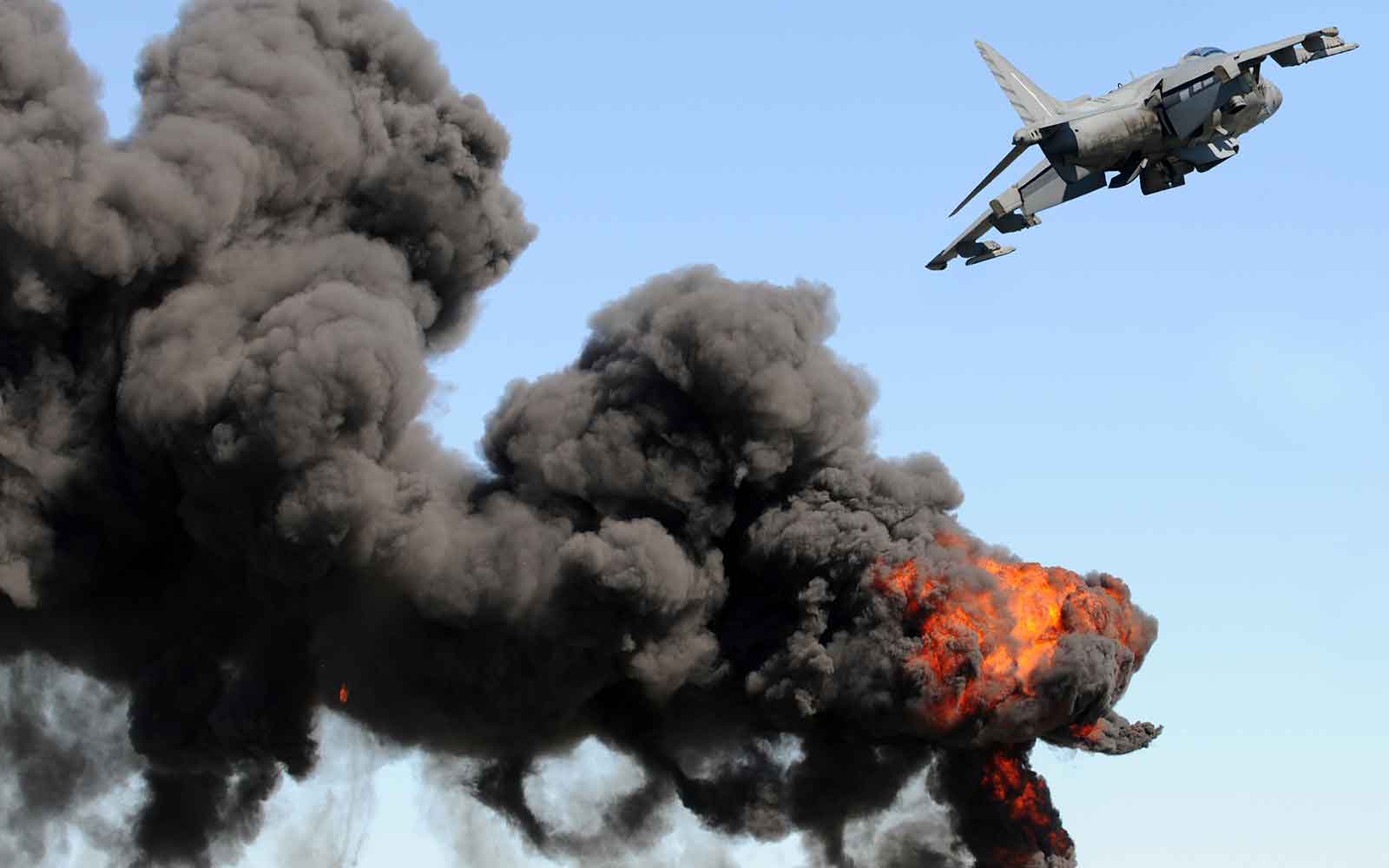 Jetfighter flying over desert landscape in Dubai, showcasing aerial combat experience.