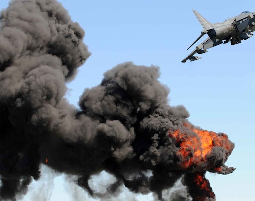 Jetfighter flying over desert landscape in Dubai, showcasing aerial combat experience.
