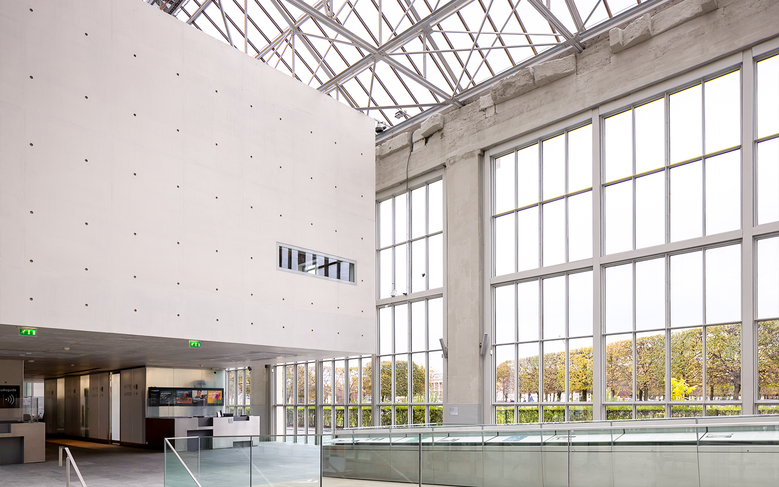 Spacious Orangerie interior with large windows and modern design.