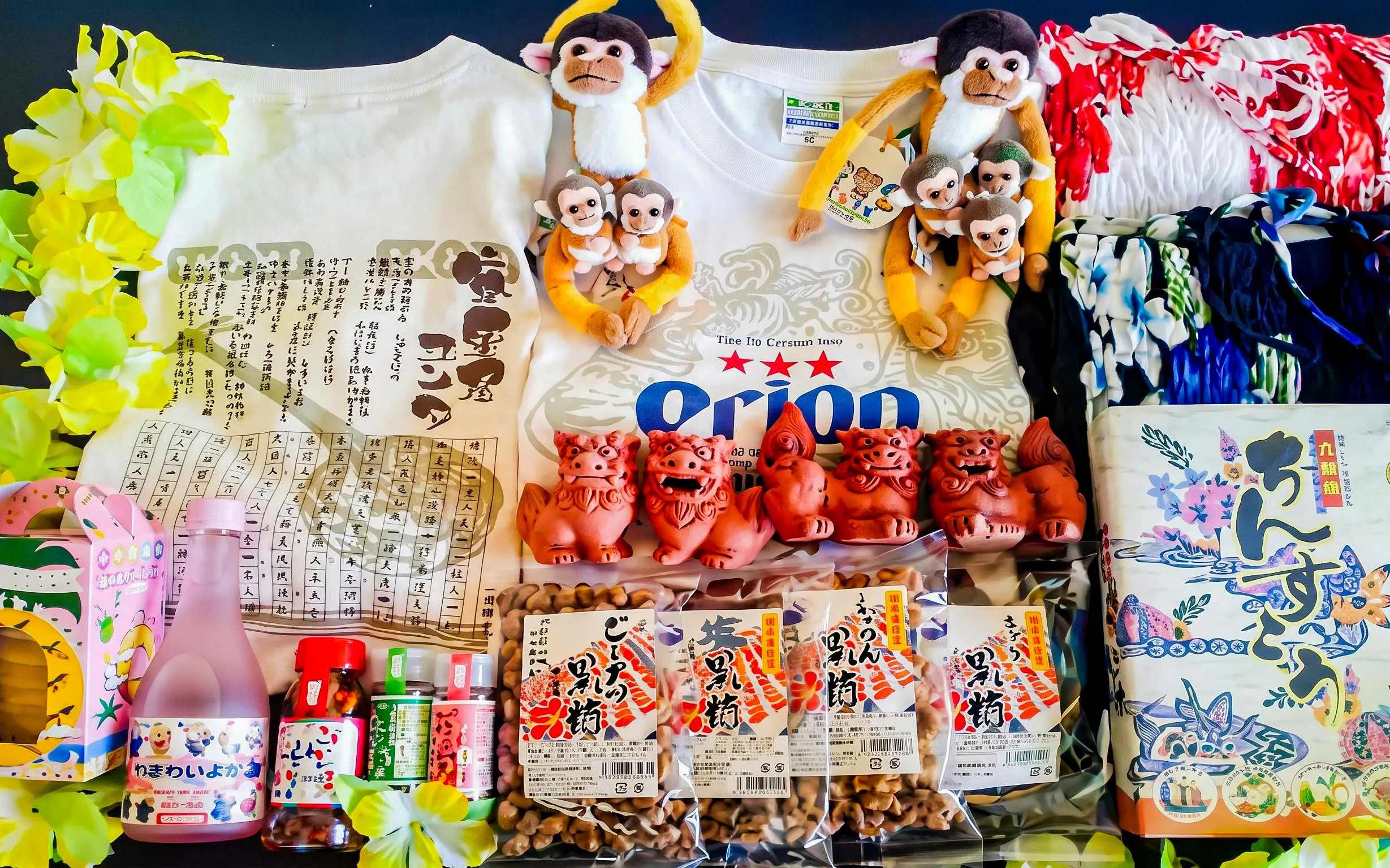 Traditional souvenirs and snacks from Ishigaki Yaima Village, including Shisa figurines and local treats.
