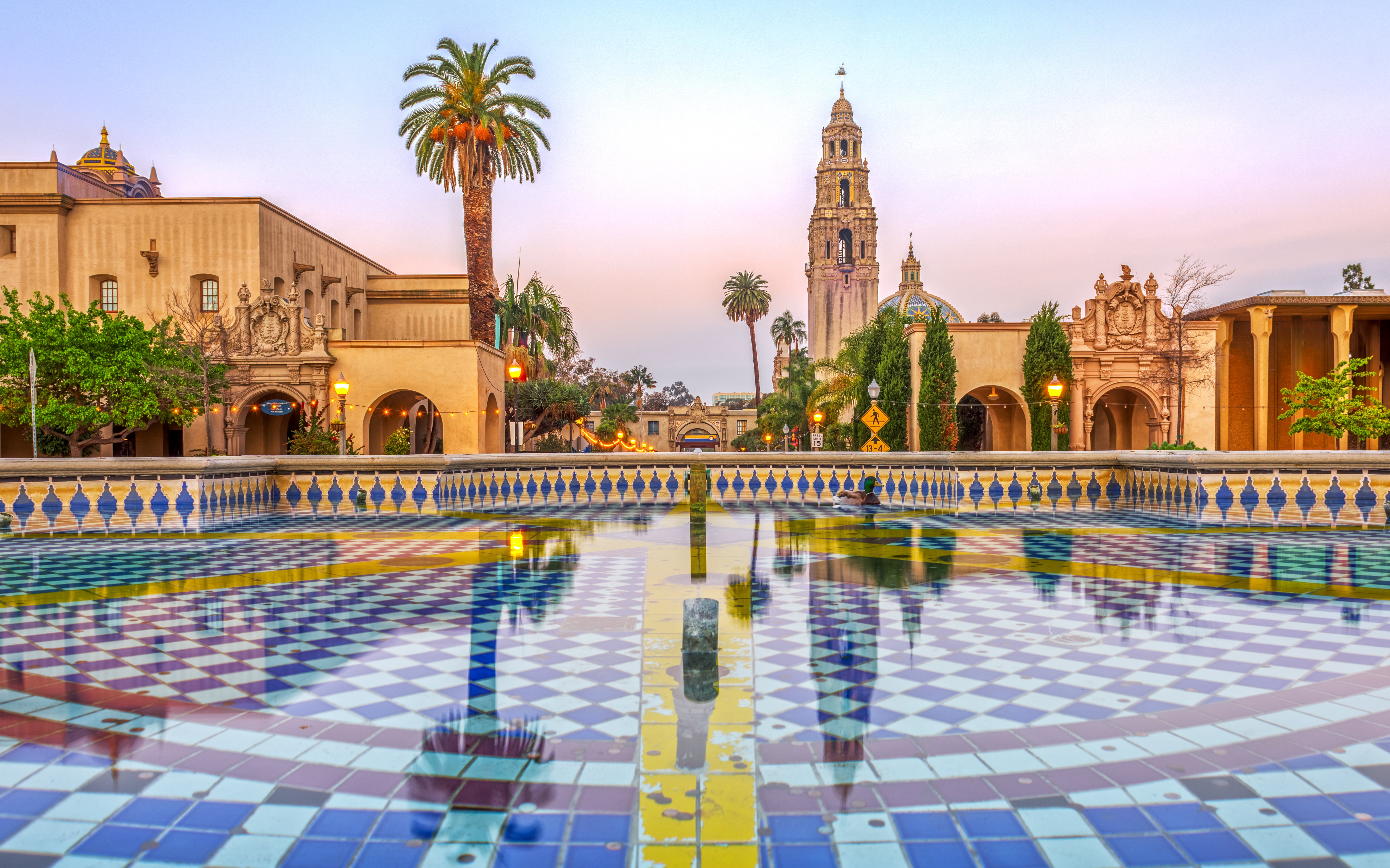 Plaza with colorful tiled fountain and historic tower in San Diego, California, USA.