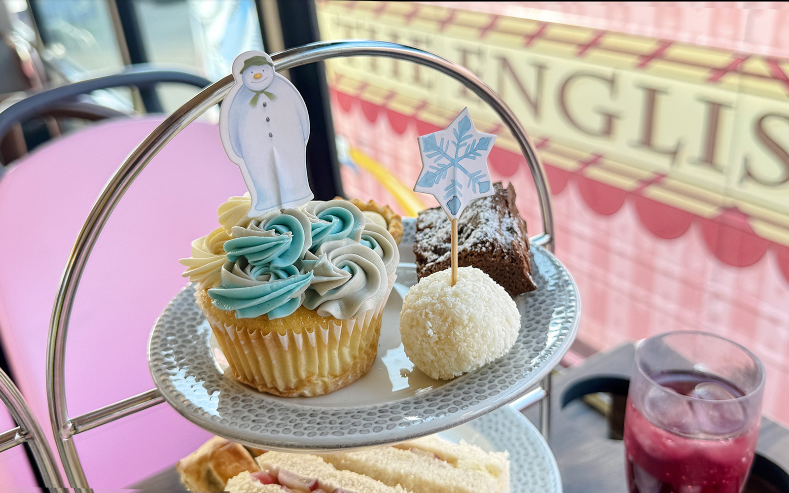 Cupcake with snowman topper on The Snowman Afternoon Tea Bus, London.