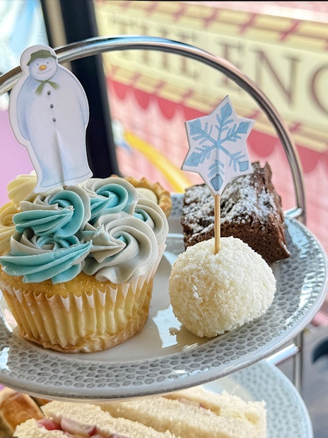 Cupcake with snowman topper on The Snowman Afternoon Tea Bus, London.