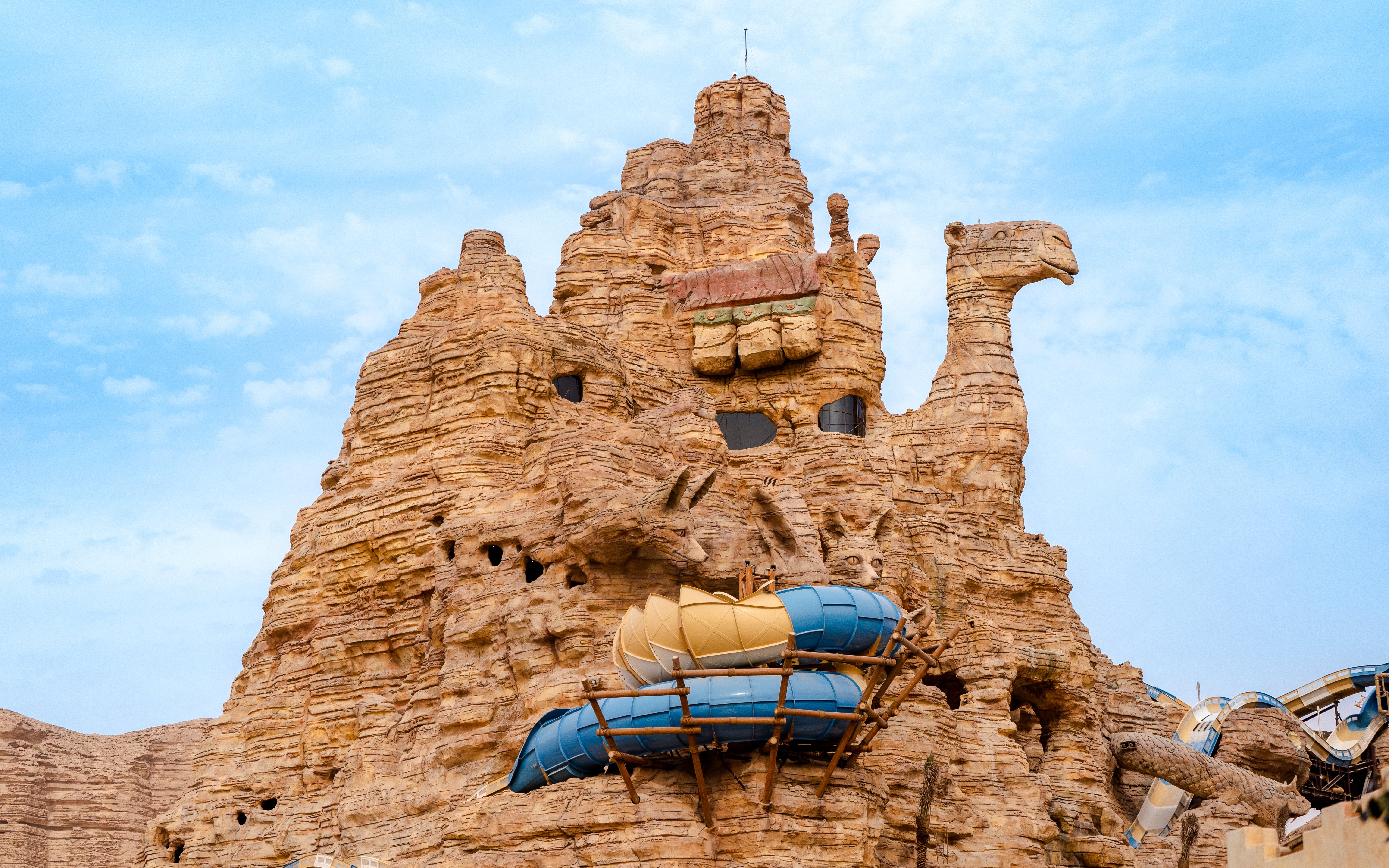 Camel-shaped rock structure with water slides at Aquarabia Water Theme Park, Qiddiya City, Saudi Arabia.
