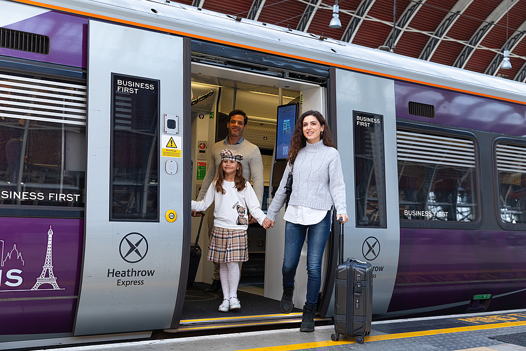 Heathrow Express train arriving at London Paddington Station platform.