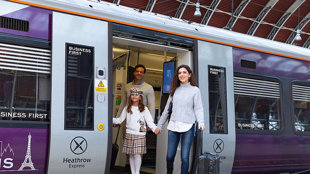 Heathrow Express train arriving at London Paddington Station platform.