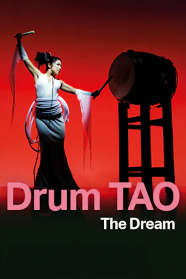 Drum Tao performers in traditional attire playing taiko drums on stage, Japan.