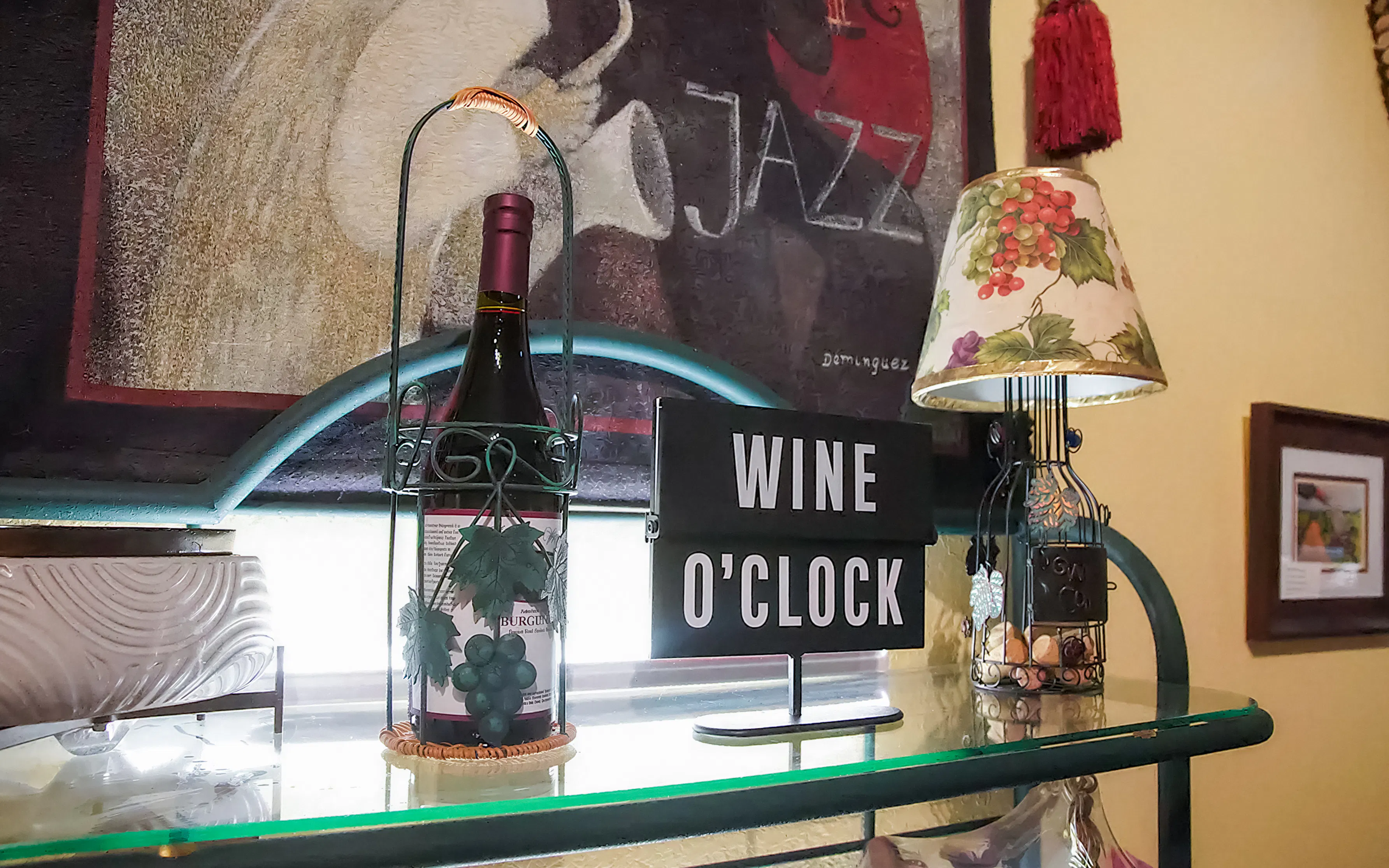 Wine bottle and "Wine O'Clock" sign at a Nevada winery tour.