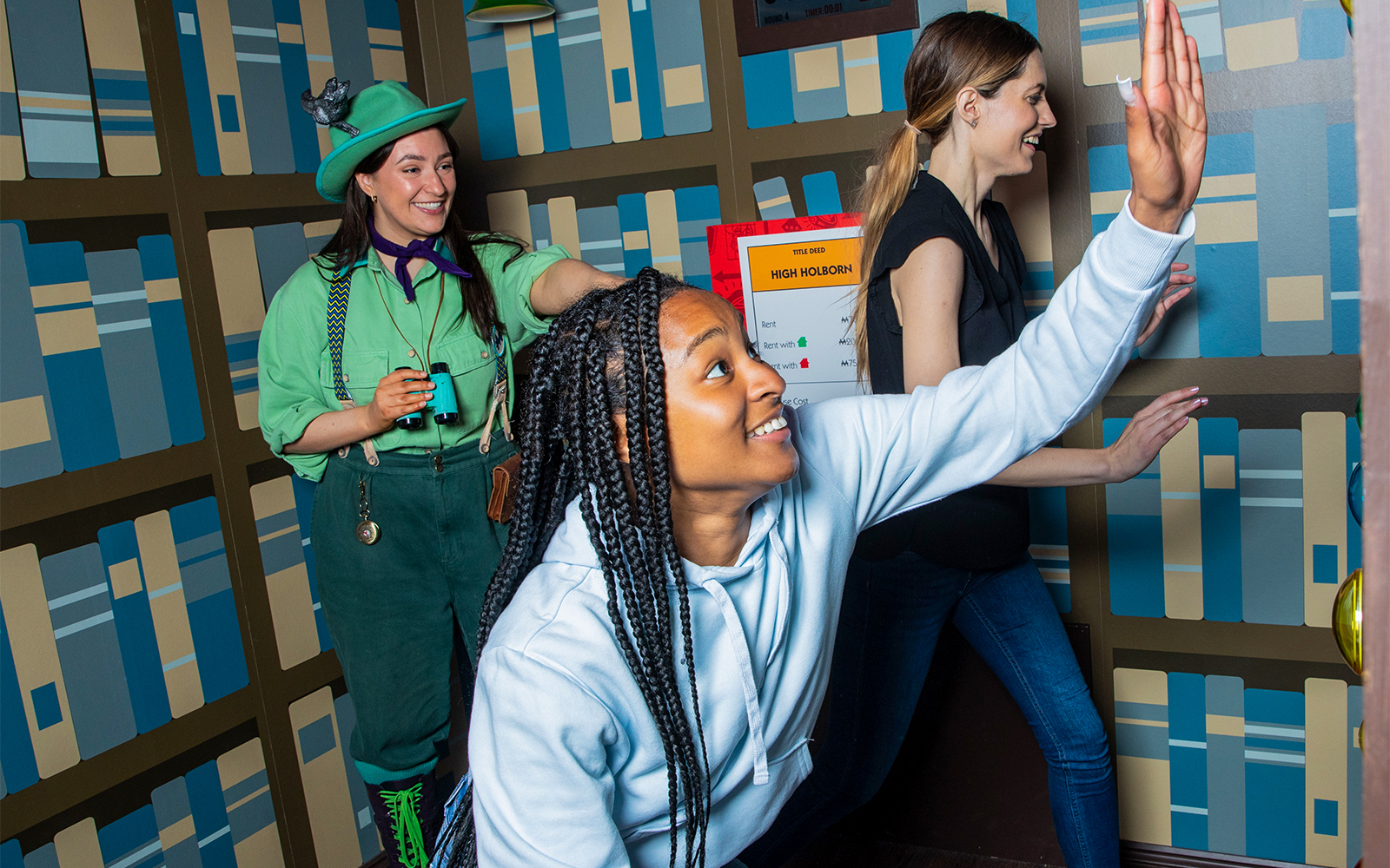 Guests playing a life-sized Monopoly game at the Monopoly Lifesized experience in London.
