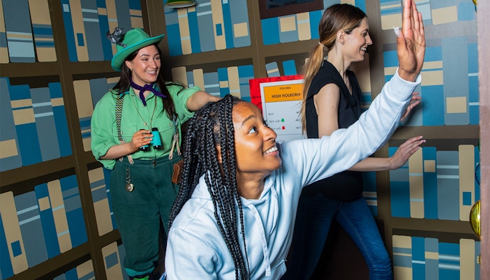 Guests playing a life-sized Monopoly game at the Monopoly Lifesized experience in London.