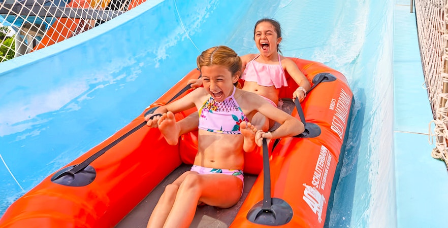 Children enjoying the Master Blaster Uphill Water Coaster at Schlitterbahn, Six Flags, New Braunfels.