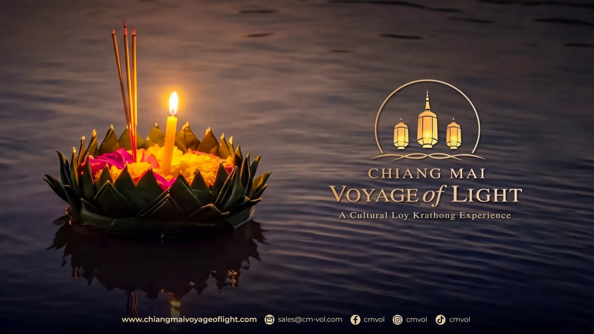 Floating krathong with candle and incense on water during Chiang Mai Voyage of Light festival.