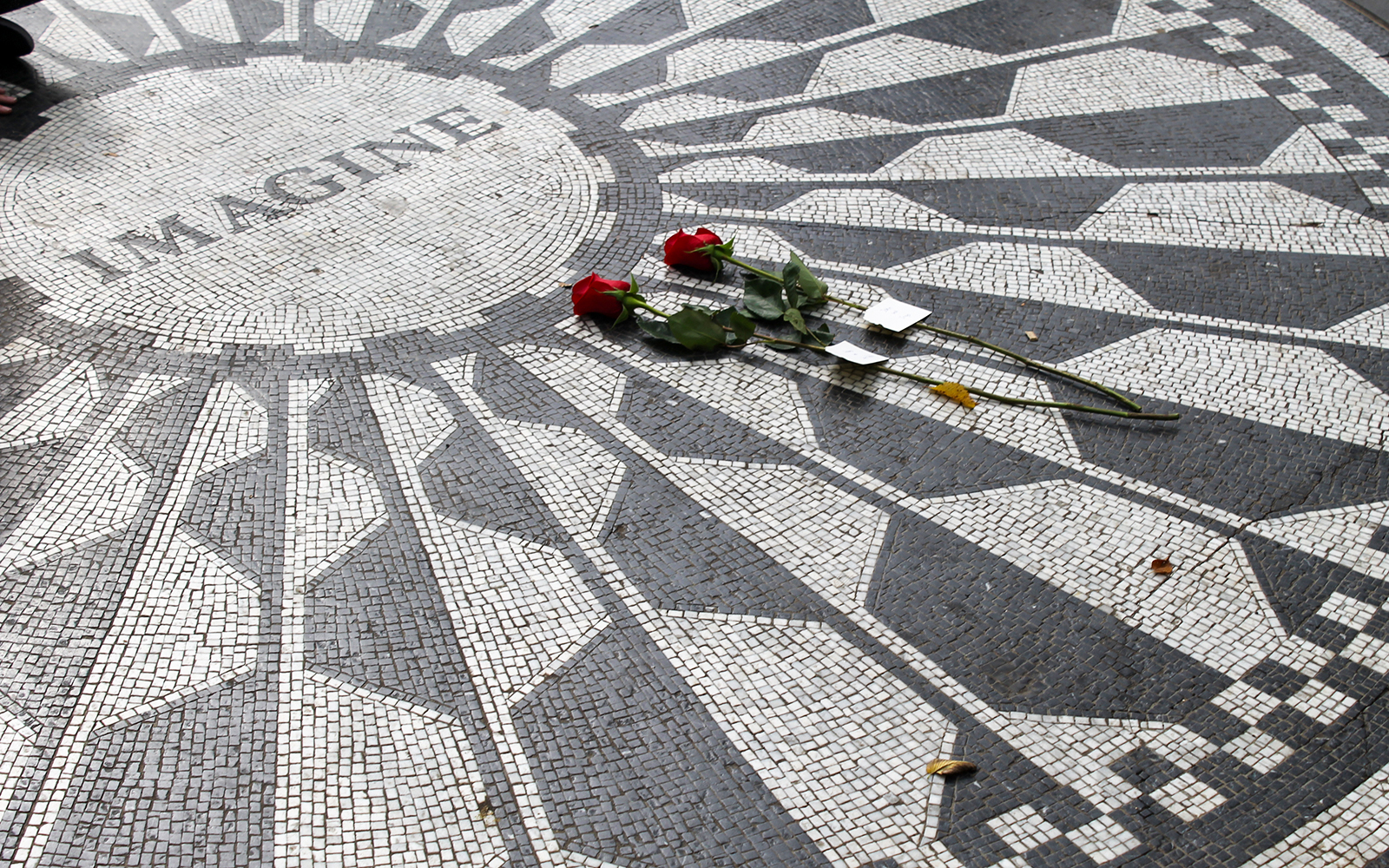 Mosaic with "Imagine" and roses at Strawberry Fields John Lennon Memorial, Central Park, New York.