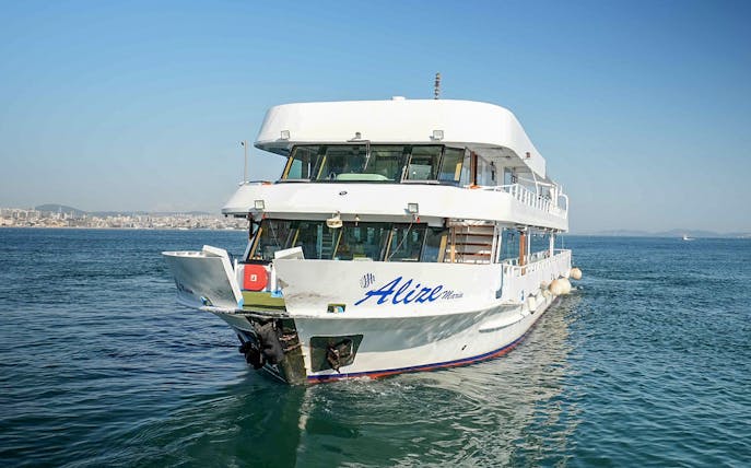 Cruise ship on Bosphorus Golden Horn with city skyline in background.