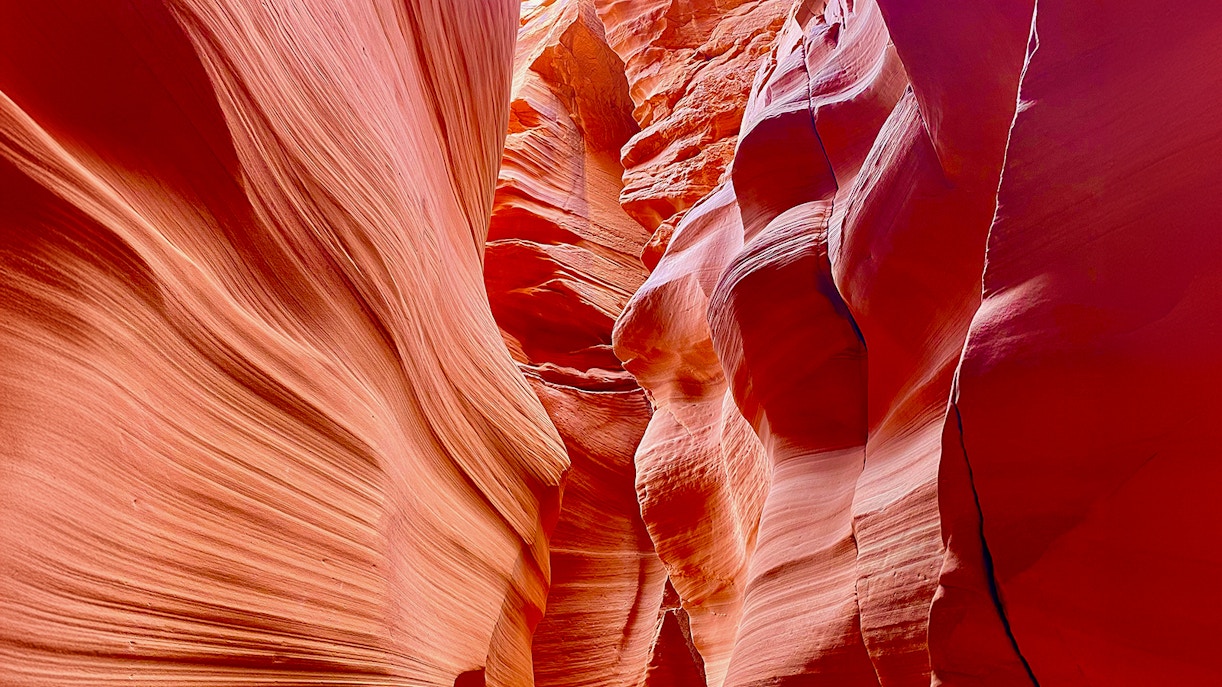 Antelope Canyon X sandstone formations with light filtering through.