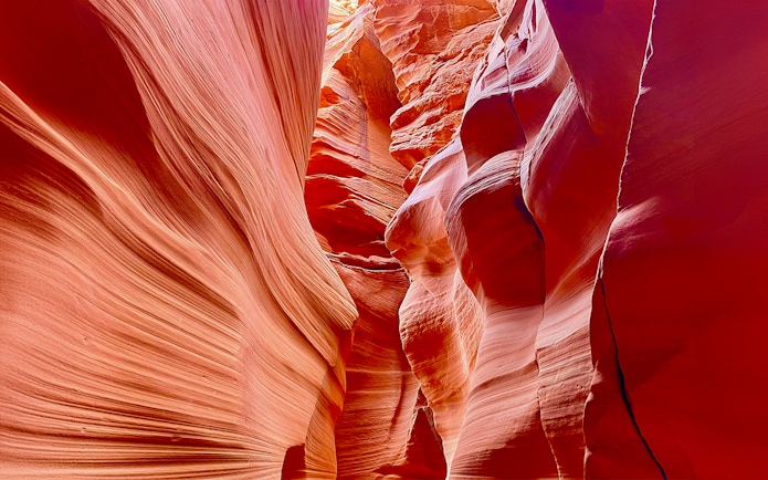 Antelope Canyon X sandstone formations with light filtering through.