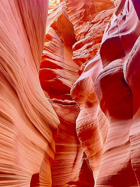 Antelope Canyon X sandstone formations with light filtering through.