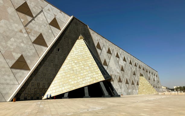 Grand Egyptian Museum exterior with geometric patterns and large entrance.