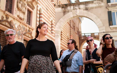 Tourists exploring Verona's historic streets on a Romeo & Juliet food tour.