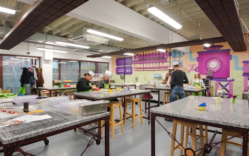 Visitors participating in a chocolate-making workshop at Chocotopia, Prague.