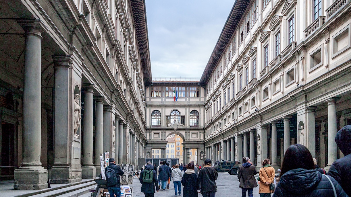 Group of tourists enjoying a skip-the-line guided visit to Accademia, Duomo & Uffizi in Florence, Italy, showcasing the city's rich art and history