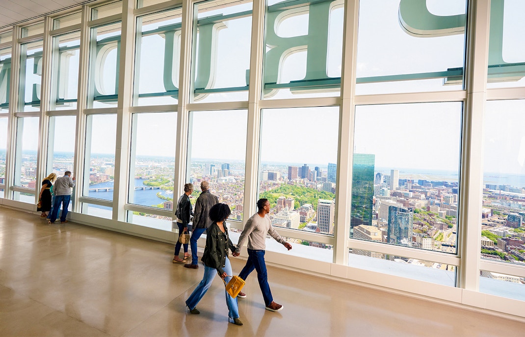 Visitors enjoying panoramic views from View Boston observation deck.