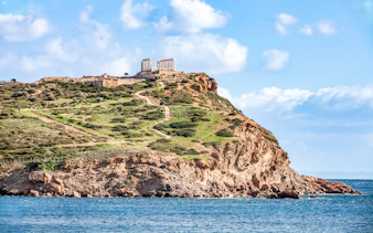 Temple of Poseidon on Cape Sounion, Greece, overlooking the Aegean Sea.