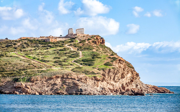 Temple of Poseidon on Cape Sounion, Greece, overlooking the Aegean Sea.