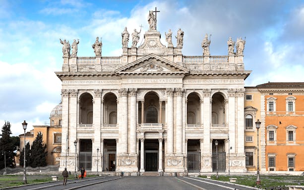 Cloister and Basilica of Saint John in Lateran facade in Rome, Italy.