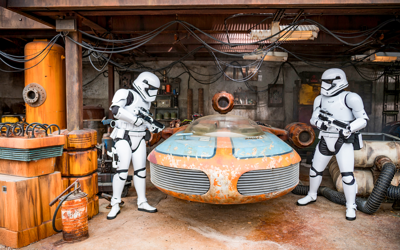 Stormtroopers with a speeder at Star Wars Galaxy's Edge, Disneyland Park, California.