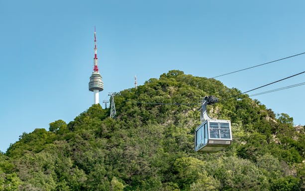Namsan cable car ascending with Namsan Tower in the background, Seoul, South Korea.