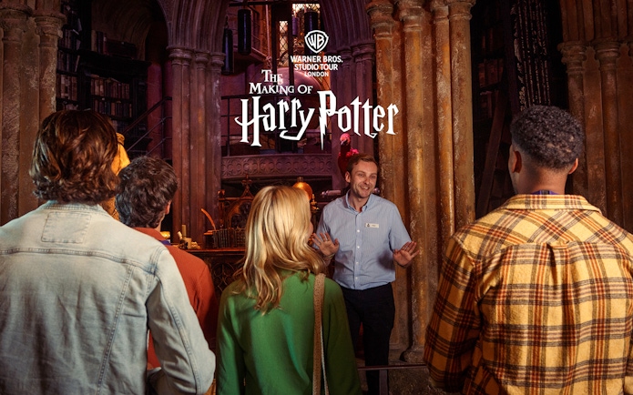 Guide leading a group at Harry Potter Warner Bros Studio Tour London.