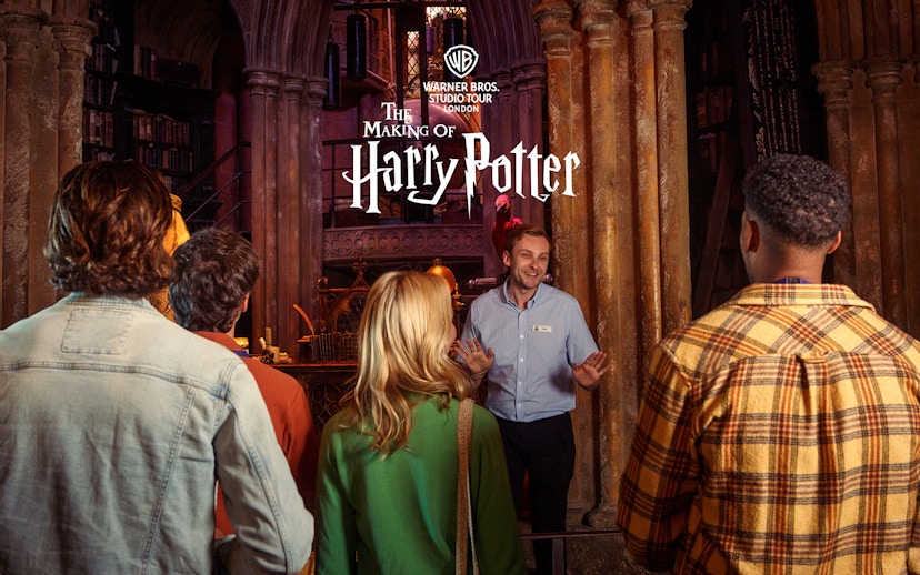 Guide leading a group at Harry Potter Warner Bros Studio Tour London.