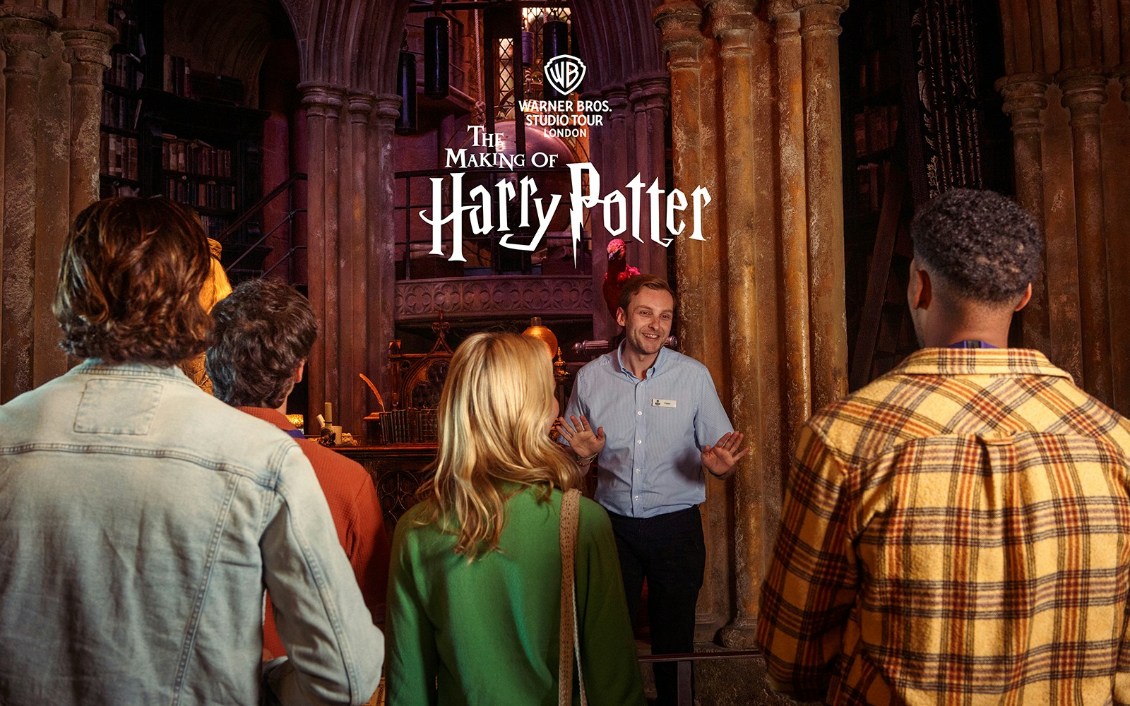 Guide leading a group at Harry Potter Warner Bros Studio Tour London.