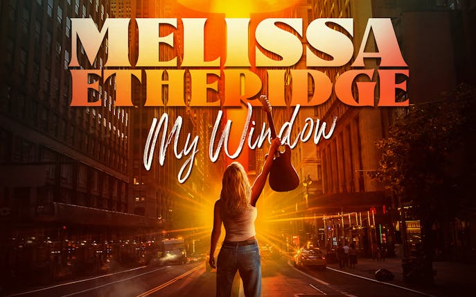 Person holding guitar on city street with 'Melissa Etheridge: My Window' text above.
