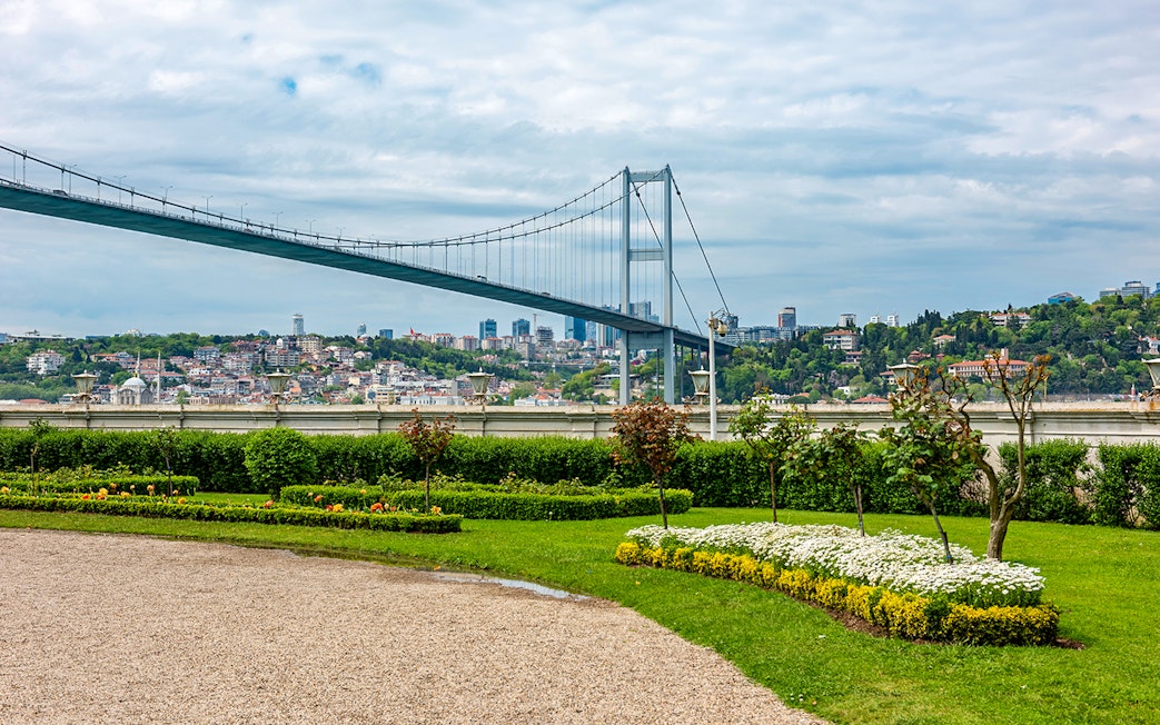 Garden view of Beylerbeyi Palace with Bosphorus Bridge in Istanbul.