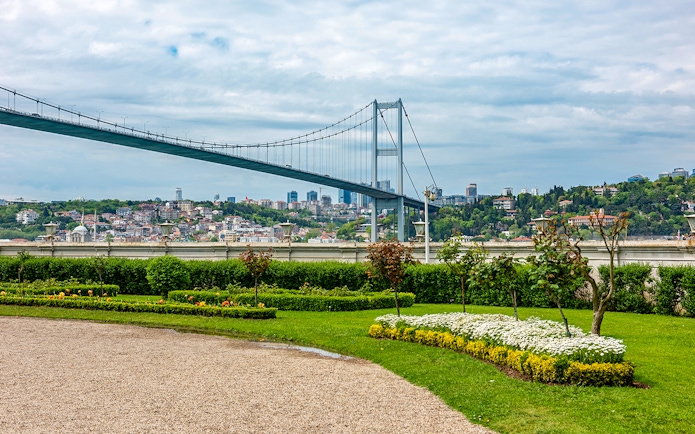 Garden view of Beylerbeyi Palace with Bosphorus Bridge in Istanbul.