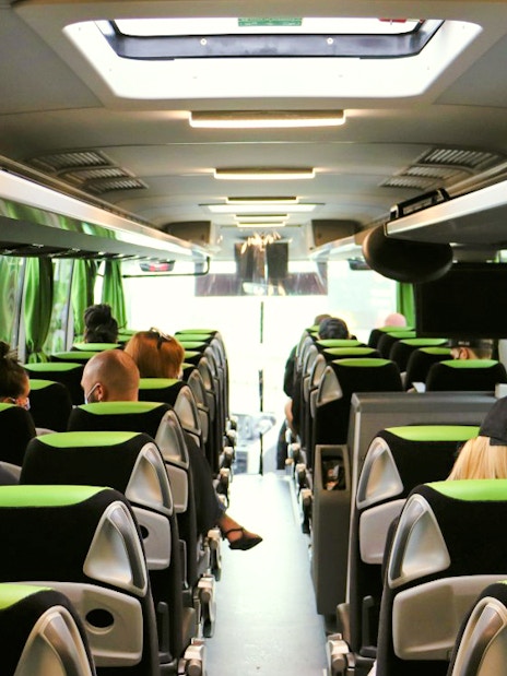 Interior of Flibco bus with passengers seated, London airport transfer.