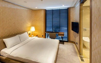 Private room with bed and desk at Primeclass Lounge, Zurich Airport Terminal E.