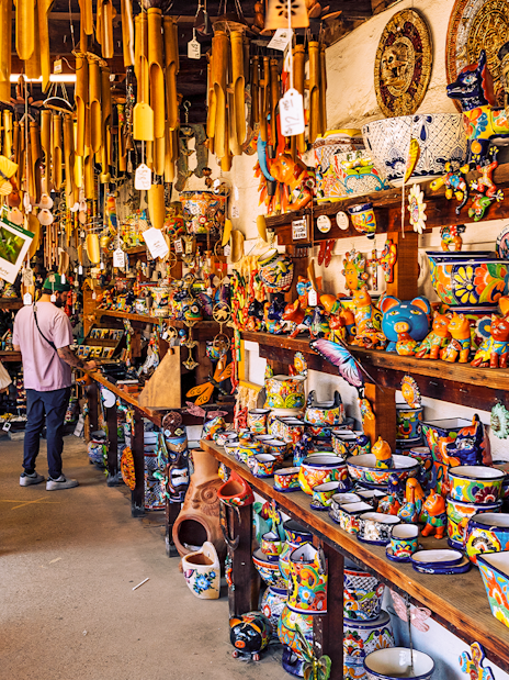 Colorful pottery and crafts in a Mexico City souvenir shop.