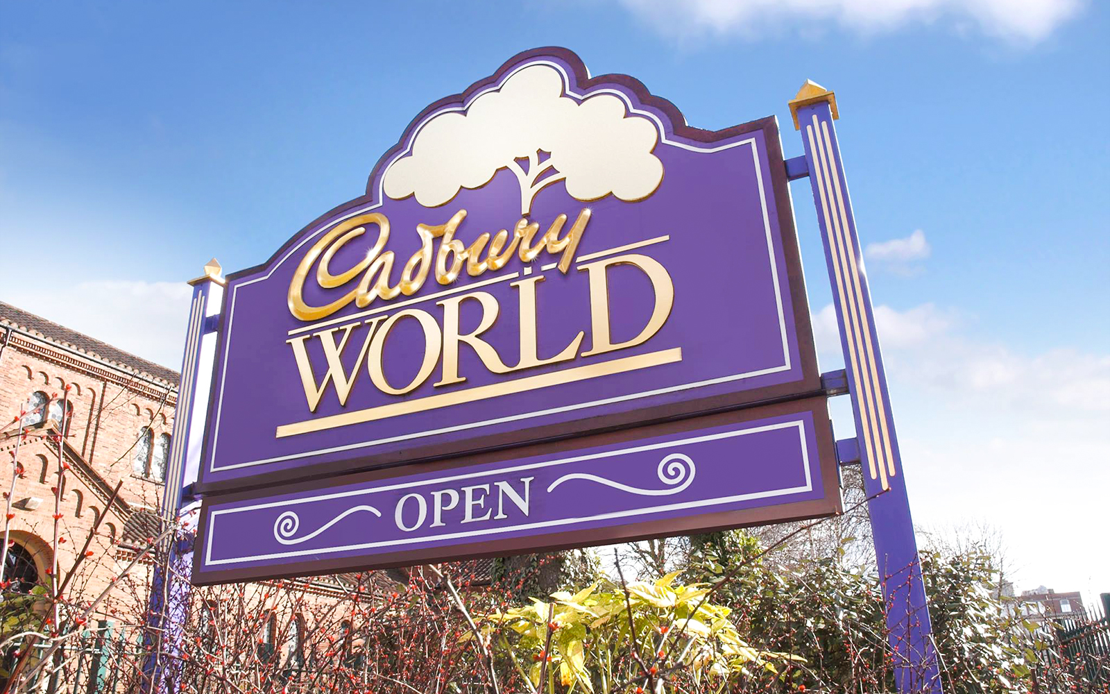 Cadbury World entrance sign with "Open" displayed, Birmingham, UK.